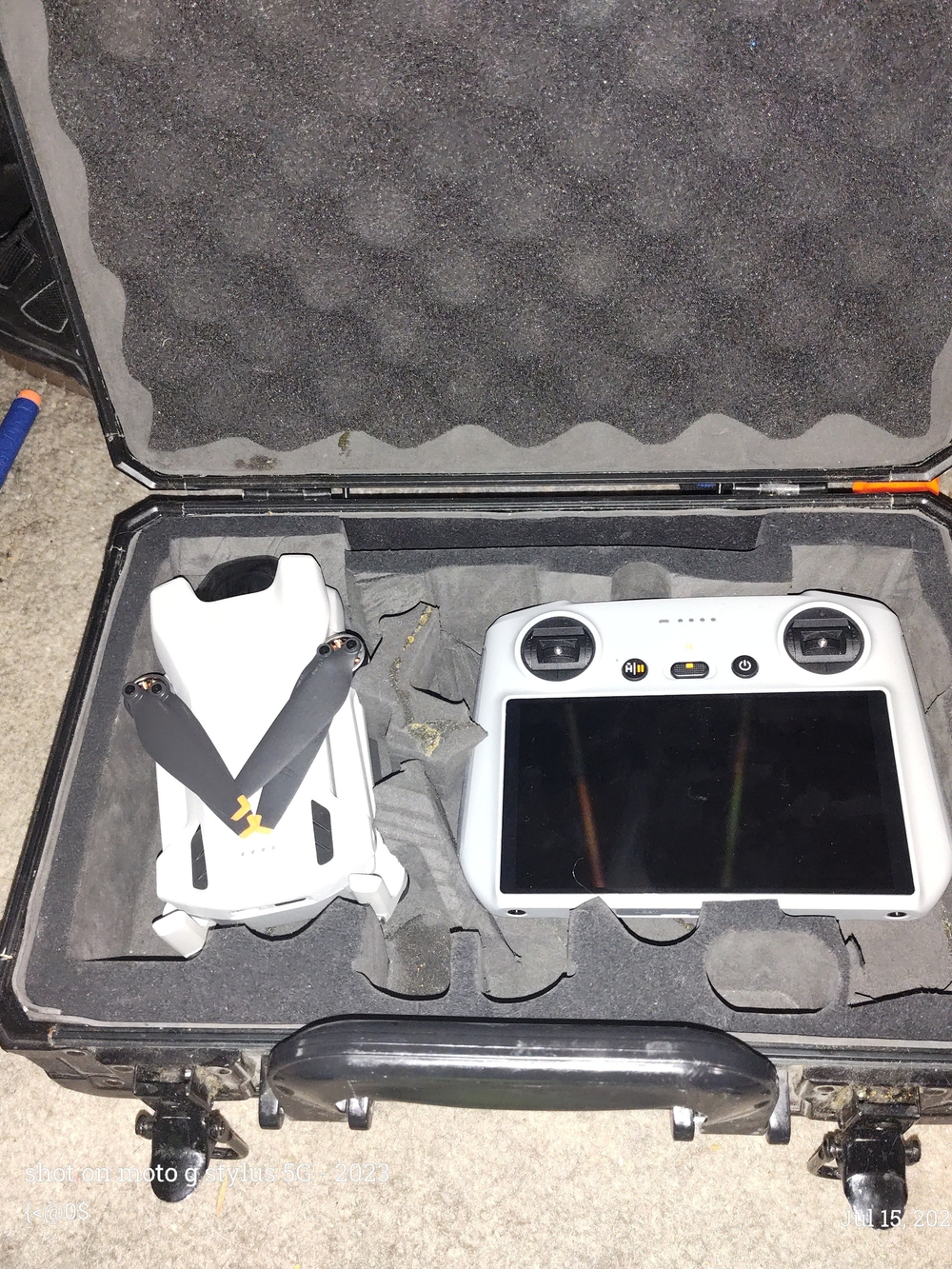DJI Mini 3  Drone and White Remote Controller